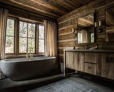 an old fashioned bathtub in a rustic bathroom