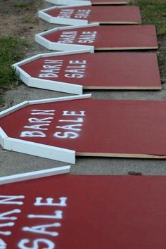 red and white street signs laying on the ground