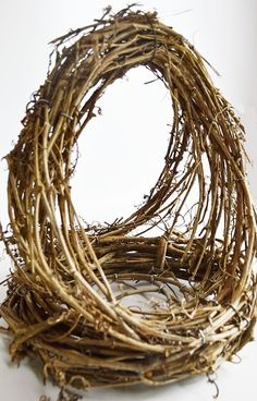 a close up of a bird nest on a white surface