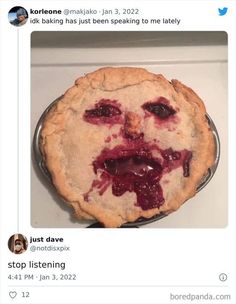 a pie with a face drawn on it sitting on top of a stove burner