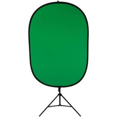 a green screen on a black tripod stand