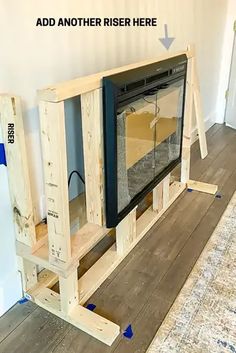 a room that has been built into the floor with some pieces of wood around it