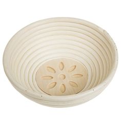 a white bowl with a flower design on the side