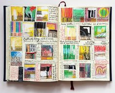 an open notebook with lots of different colored pencils on the pages and writing in it