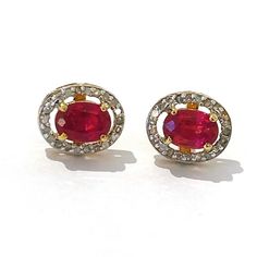 This is part of Chairish’s Fine Jewelry assortment.  Natural red ruby, oval shape - 2 carats Natural gray single cut diamonds - 1 carat   The earrings from the "Orient" traveling collection are the epitome of elegance and versatility. They offer a perfect blend of day to night and swimwear to evening wear, allowing you to effortlessly transition between different occasions and outfits. Wearing these spectacular drop oriental-style earrings will undoubtedly make you the center of attention. They Ruby Diamond Earrings In Fine Jewelry Style, Ruby Gemstone Diamond Earrings In Fine Jewelry Style, Red Oval Earrings For Formal Occasions, Red Oval Earrings For Anniversary, Formal Red Oval Earrings, Oval Diamond Earrings With Gemstone, Hallmarked Oval Diamond Earrings, Classic Red Diamond Earrings, Ruby Halo Earrings In Fine Jewelry Style