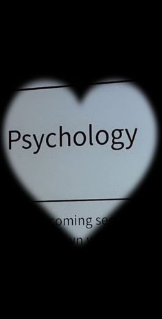 the shadow of a heart on a sign that says psychology