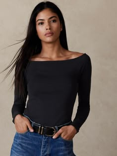 An elegant statement piece to show off the neck and collarbone, this soft boat-neck tee uses a specially-washed cotton jersey to create sumptuous handfeel with added stretch to hold and smooth.  FITTED: Stretches to fit.  Boatneck.  Straight hem.  Fi Stripe Boatneck Top, Black Boat Neck Sweater, Boat Neck Blouse Outfit, Notch Neck Sweater, Sabrina Neckline Top, Black Boat Neck Top, Boatneck Outfit, Boat Neckline Top, Blouse Boat Neck Designs Latest