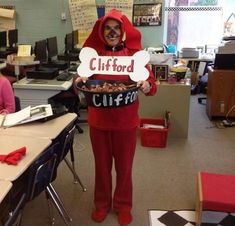 a person in a red outfit holding a sign