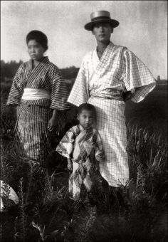 an old photo of two women and a child