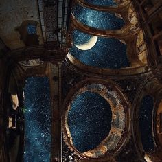 looking up at the ceiling in an old building with stars and moon on it's side