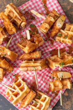 chicken and waffles on skewers with toothpicks are ready to be eaten