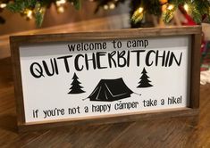 a sign that says, welcome to camp outbackchin if you're not a happy camper take a hike