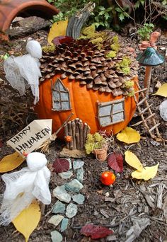 there is a small pumpkin house on the ground