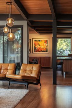 a living room filled with furniture and lots of windows