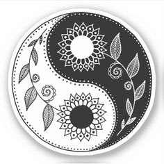 a black and white yin - yang symbol with flowers