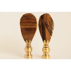 two wooden spoons sitting on top of each other