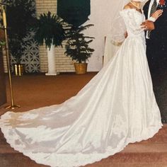 a bride and groom pose for a photo in front of the alter at their wedding