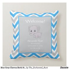 a blue and gray chevron birth pillow with an elephant on it