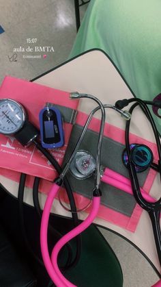 a stethoscope, blood pressure meter and other medical equipment on a table