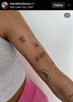 a woman's arm with tattoos on it