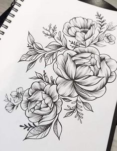 a black and white drawing of flowers on paper