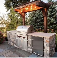 an outdoor grill with lights on it