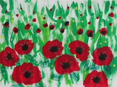 a painting of red poppies in green grass on a white background with watercolors