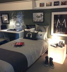 a bed room with a neatly made bed and pictures on the wall