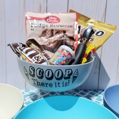 a bowl filled with candy and candies on top of a table