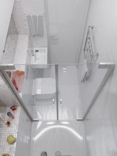 an aerial view of a bathroom with glass shower doors