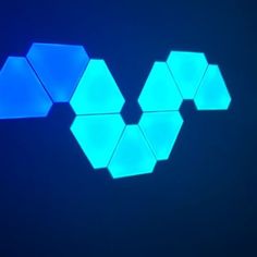 three hexagons are shown against a dark background