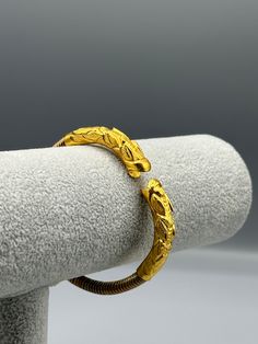 Our 24k Polished Bangles are more than just accessories; they are symbols of grace and beauty, inspired by the rich heritage of Indian, Pakistani, and Nepali jewelry. These stunning bangles showcase the timeless elegance of traditional craftsmanship, perfectly complementing your attire for weddings, festivals, or any special occasion Our company offers expedited Next-Day Delivery Services within the United Kingdom, ensuring prompt and efficient transportation of goods.  Additionally, we strive to extend our shipping capabilities to cater to customers worldwide, aiming to provide the fastest possible shipping methods to international destinations. To ensure the highest standards of hygiene, we kindly request your understanding that all sales are final, and we are unable to accept returns or Pancharatna Bangle, Yellow Gold Ritual Bracelet Jewelry, Yellow Gold Rituals Bracelet Jewelry, Yellow Gold Bracelet Jewelry For Rituals, Traditional Jewelry With Historical Design For Ceremonial Use, Ornate Gold Bracelets For Festivals, Adjustable Gold Bracelet For Ceremonial Occasions, Ornate Gold Bracelet For Festivals, Elegant Handmade Gold Bracelet For Ceremonial Occasions