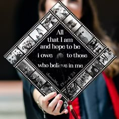 a woman holding up a graduation cap with film strips on it that says,'all that i am and hope to be i own to those who believe in me '