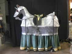 the horse is made out of paper and fabric