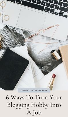 an open laptop computer sitting on top of a desk next to a notebook and lipstick