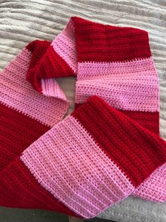 Hand-Crocheted Two-Toned Striped Scarf - Cozy, Stylish, and Perfectly Warm Brighten up chilly days with this stunning hand-crocheted scarf, featuring two beautifully coordinated shades of pink in bold, eye-catching stripes. Designed with both style and warmth in mind, this scarf is the perfect accessory to elevate your winter wardrobe or gift to someone special. Made with care and precision, the scarf's soft texture and modern stripe pattern make it a versatile piece you'll reach for all season Crochet Scarf Checkered, Crochet Scarf 2 Color, Fun Scarf Crochet Patterns, Winter Crochet Scarf, Crochet Scarf Pink, Striped Scarf Crochet, Crochet Red Scarf, Crochet Ideas Clothes Winter, Crochet Scarf Striped