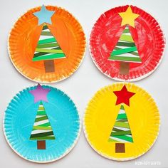 four paper plates with christmas trees on them