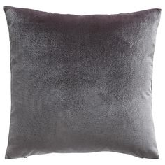 a grey velvet pillow on a white background