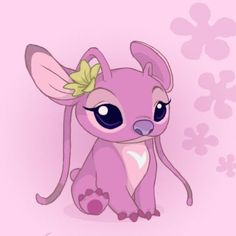 a little pink animal with a flower in its hair