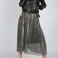 Metallic Coated Pleated Maxi Skirt in Silver. A gorgeous statement piece to add to your western cowgirl chic wardrobe. How cute would this be with a graphic tee, boots and a cute denim jacket? Or dress it up more for date night. This is an extremely versatile piece for a well rounded boho cowgirl style. Metallic coated pleat fabricAccordion pleatsElastic waistbandHigh waistlineMaxi lengthRegular fitColor: SilverModel size 5' 10" wearing S sizeCaring for your clothes is caring for the environment Fall Party Skirt, Trendy Long Skirt For Fall, Glamorous Fitted Skirt For Fall, Lined Skirt Bottoms For Night Out In Fall, Edgy Lined Skirt For Fall, Fall Long Skirt For Night Out, Fall Skirt For Night Out, Trendy Fall Pencil Skirt, Trendy Fall Skirt