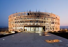 the building has many windows and is lit up at night