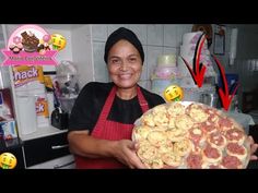 a woman holding a plate full of food