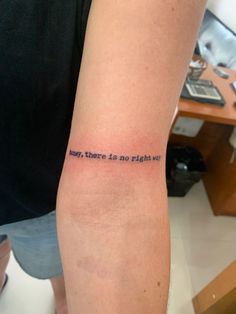 a person with a tattoo on their arm that says, there is no right in