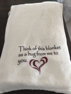 a white towel with the words think of this blanket as a hug from me to you