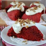 some red velvet desserts are on a white plate