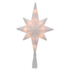 a white lighted christmas star on a pole