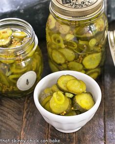 pickles in glass jars on a wooden table