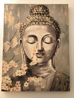 a painting of a buddha statue with flowers in front of it on a white wall