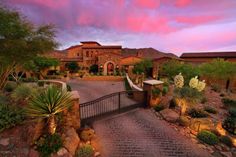 a large home with a driveway leading to it