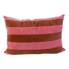 a pink and brown striped pillow on a white background